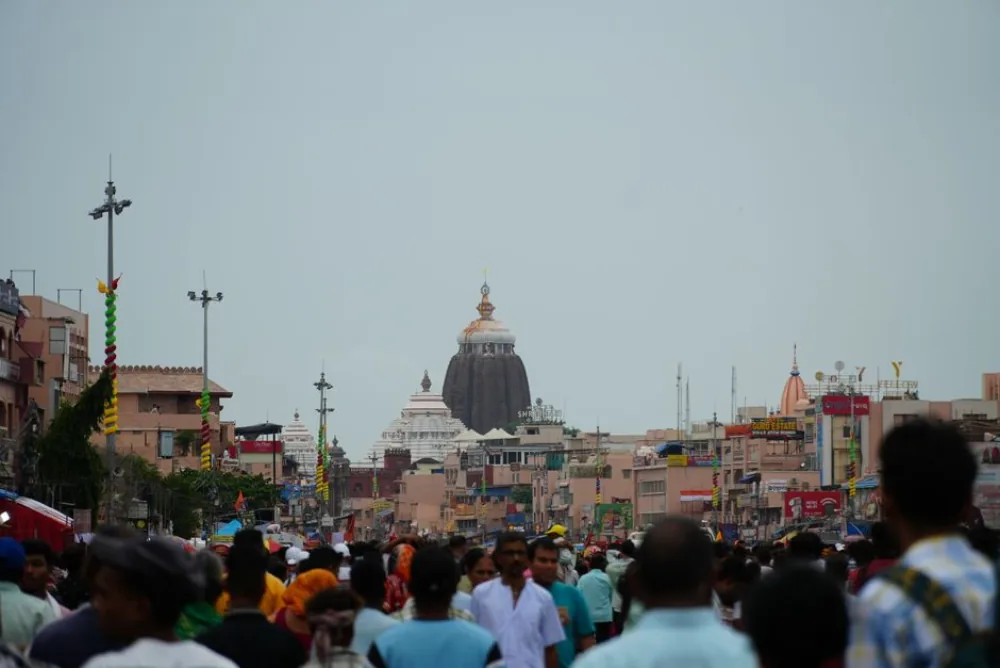 Pilgrims on Grand Road (Bada Danda) before the Jagannath Temple tower, Puri, Odisha