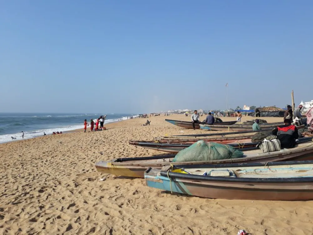Traditional nolia fishing boats on the golden sands of Puri Beach, Odisha